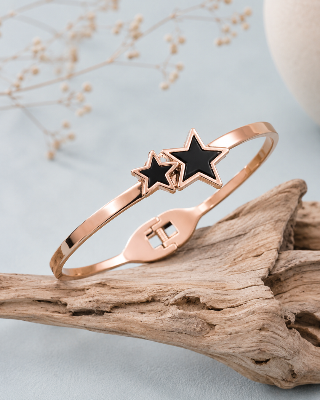 Twin star rose gold bracelet with black accents