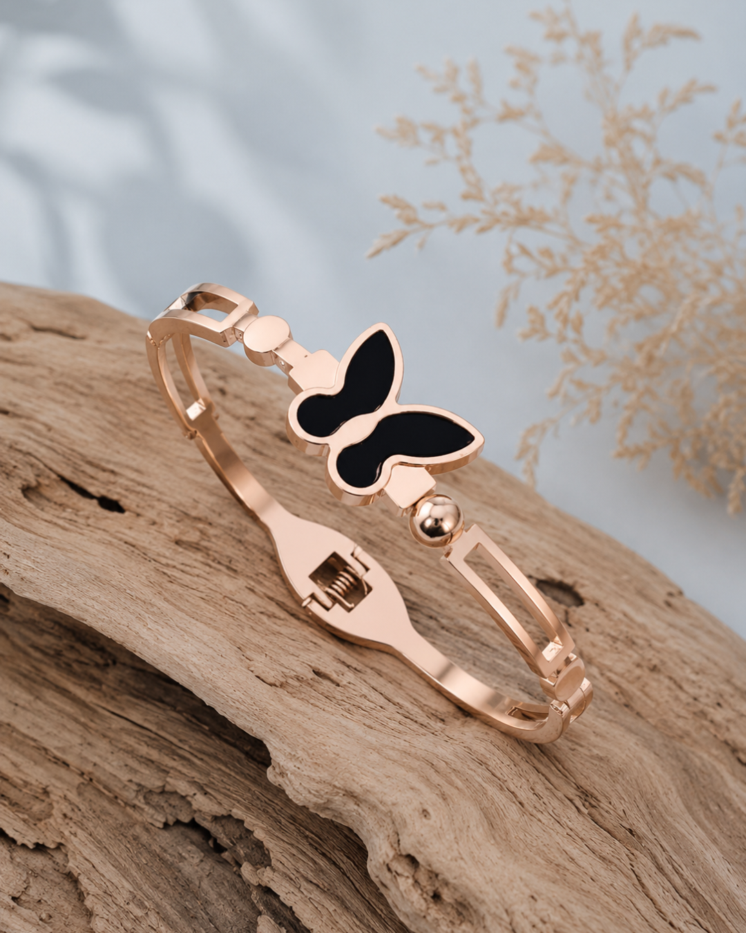 Flutter rose gold butterfly bracelet with black enamel