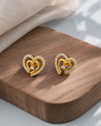 Golden CZ heart stud earrings for women
